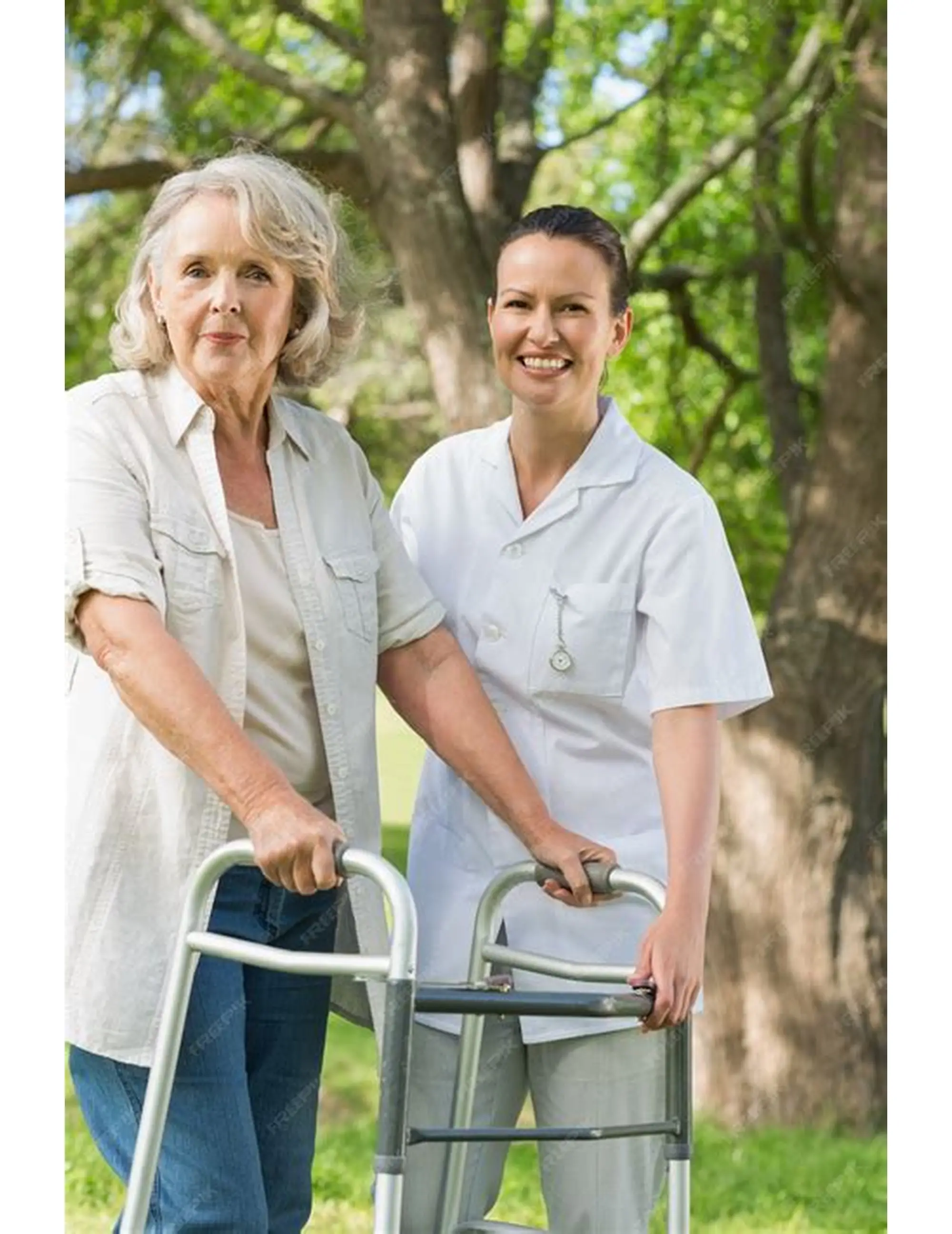 Caregiver accompanying an older woman using a walker outdoors