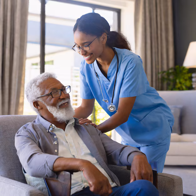 Caregiver sharing a warm moment with an older adult at home